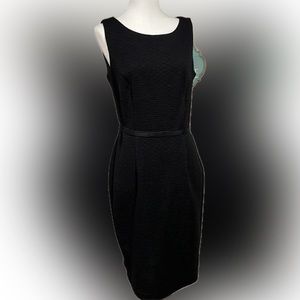 Taylor brand little black dress with silver lace overlay on backside.